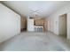 Bright living room featuring a kitchen pass-through and ceiling fan at 2289 Twickingham Ct, Clermont, FL 34711