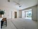 Living room with tiled floors and access to patio at 2289 Twickingham Ct, Clermont, FL 34711