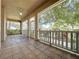 Screened porch with tiled floor and access to backyard at 2289 Twickingham Ct, Clermont, FL 34711