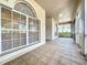 Covered patio with tile flooring and view of backyard at 2289 Twickingham Ct, Clermont, FL 34711