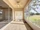 Screened patio with tiled flooring and golf course views at 2289 Twickingham Ct, Clermont, FL 34711