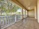 Spacious screened porch with tiled floor and views of the backyard at 2289 Twickingham Ct, Clermont, FL 34711