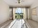 Sunroom with tiled floor and view of backyard at 2289 Twickingham Ct, Clermont, FL 34711