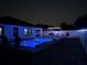 Night view of a refreshing pool and patio area, perfect for relaxation at 2320 Blue Meadows Ct, Apopka, FL 32703