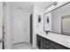 Modern bathroom with gray vanity, white quartz countertop and a large mirror at 2320 Blue Meadows Ct, Apopka, FL 32703