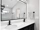 Bathroom with double sinks, large mirror, and modern fixtures at 2320 Blue Meadows Ct, Apopka, FL 32703