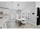 Bright dining area with white table and chairs, near kitchen at 2320 Blue Meadows Ct, Apopka, FL 32703