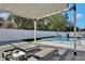 Relaxing pool deck with shaded seating area, perfect for lounging at 2320 Blue Meadows Ct, Apopka, FL 32703