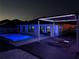 Expansive pool deck with pergola and lounge chairs at night at 2320 Blue Meadows Ct, Apopka, FL 32703