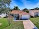 Aerial view of charming house with driveway at 2371 Wilson Way, The Villages, FL 32162