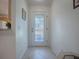 Bright entryway with tile floor and glass door at 2371 Wilson Way, The Villages, FL 32162