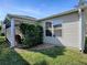 House exterior showcasing a tan vinyl siding at 2371 Wilson Way, The Villages, FL 32162