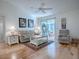 Living Room with hardwood floors, light walls and comfy seating at 2371 Wilson Way, The Villages, FL 32162