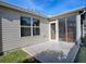 Screened-in patio with concrete slab and sliding door at 2371 Wilson Way, The Villages, FL 32162