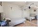 Bedroom featuring wood floors, a lightly stained wooden bed frame, and a mirror at 2385 Sw 159Th Ln, Ocala, FL 34473