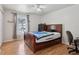 Bedroom featuring a bed, ceiling fan, and view of the pool at 2385 Sw 159Th Ln, Ocala, FL 34473