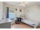 Bedroom with wood floors, a lightly stained wooden bed frame, and a window at 2385 Sw 159Th Ln, Ocala, FL 34473