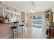 The dining room leads into the kitchen area and features a view through sliding glass doors to the pool at 2385 Sw 159Th Ln, Ocala, FL 34473