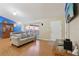 This living room features laminate floors, a foosball table, and a blue accent wall at 2385 Sw 159Th Ln, Ocala, FL 34473