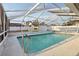 Enjoy the crystal clear waters of this screened-in pool and lanai in this backyard setting at 2385 Sw 159Th Ln, Ocala, FL 34473
