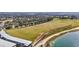 Overhead view of a large golf course with a practice area and waterfront at 2420 Prairie Dunes, Clermont, FL 34711