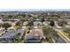Aerial view of a neighborhood with well-maintained homes and mature trees at 2420 Prairie Dunes, Clermont, FL 34711