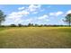 Landscaped backyard with golf course view at 2420 Prairie Dunes, Clermont, FL 34711