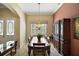 Elegant dining room featuring a wooden table and hutch at 2420 Prairie Dunes, Clermont, FL 34711