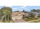 Single-Gathering home with tile roof, two-car garage, and landscaped yard at 2420 Prairie Dunes, Clermont, FL 34711