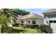 Charming single-story home with a well-manicured lawn and lush landscaping at 2420 Prairie Dunes, Clermont, FL 34711