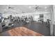 Well-equipped fitness center with treadmills, weights, and mirrored walls, offering a variety of workout options at 2420 Prairie Dunes, Clermont, FL 34711