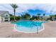 Community outdoor pool featuring multiple seating areas, a gazebo, and lush landscaping for a resort-like feel at 2420 Prairie Dunes, Clermont, FL 34711