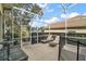 Screened patio with lounge chairs near pool at 2420 Prairie Dunes, Clermont, FL 34711