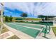 Outdoor shuffleboard courts with green surfaces, benches, and covered seating areas, surrounded by landscaping at 2420 Prairie Dunes, Clermont, FL 34711