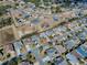 Aerial view of single Gathering home and neighborhood at 2549 Buttonwood Run, The Villages, FL 32162