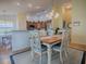 Dining room with light wood table and coastal decor at 2549 Buttonwood Run, The Villages, FL 32162