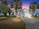 Single Gathering home with driveway and landscaping at 2549 Buttonwood Run, The Villages, FL 32162