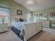 Spacious main bedroom with a comfortable bed and a dresser at 2549 Buttonwood Run, The Villages, FL 32162