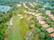 Aerial view of a golf course and residential neighborhood at 25921 San Rafael Ct, Howey In The Hills, FL 34737