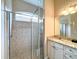 Bathroom features a large shower and granite countertop vanity at 25921 San Rafael Ct, Howey In The Hills, FL 34737