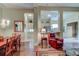 Elegant dining room with hardwood floors and a view into the kitchen at 25921 San Rafael Ct, Howey In The Hills, FL 34737