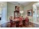 Bright dining room with hardwood floors and chandelier at 25921 San Rafael Ct, Howey In The Hills, FL 34737