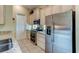 Well-equipped kitchen featuring stainless steel appliances and granite countertops at 25921 San Rafael Ct, Howey In The Hills, FL 34737