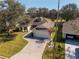 Aerial view of a house with a two-car garage and landscaped yard at 26709 Augusta Springs Cir, Leesburg, FL 34748