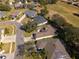 Aerial view showing a house's location in a neighborhood near a golf course at 26709 Augusta Springs Cir, Leesburg, FL 34748