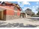 Red and green community building with stone facade at 26709 Augusta Springs Cir, Leesburg, FL 34748