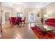 Dining area with red chairs and a glass-top table at 26709 Augusta Springs Cir, Leesburg, FL 34748