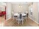 Bright dining room with white table and gray chairs at 26709 Augusta Springs Cir, Leesburg, FL 34748