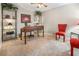 Cozy home office with a vintage desk, shelving, and a ceiling fan for added comfort at 26709 Augusta Springs Cir, Leesburg, FL 34748