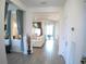 Open entryway leading to the living spaces with tile floors and neutral decor at 314 Salt Marsh Ln, Groveland, FL 34736